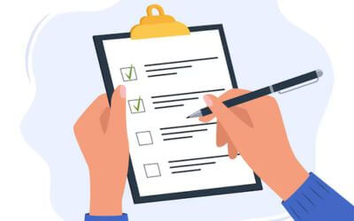 Motiv med en hånd, der udfylder et dokument.